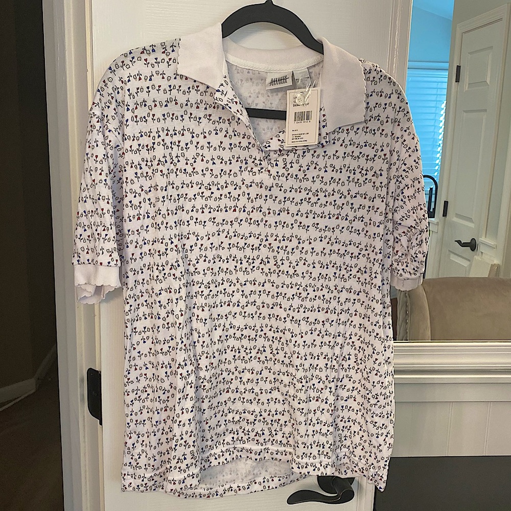 NWT short sleeved knit shirt with tulips with scalloped collar and sleeves.